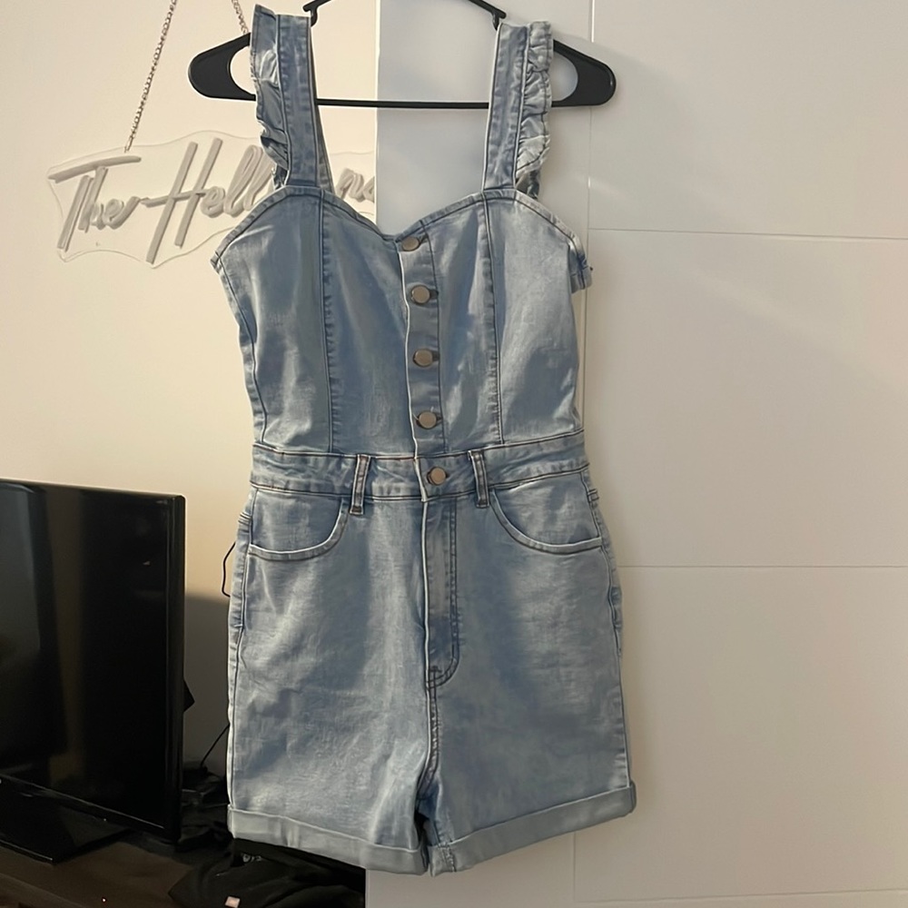 Francesca’s Denim Romper with ruffle shoulder Strap
